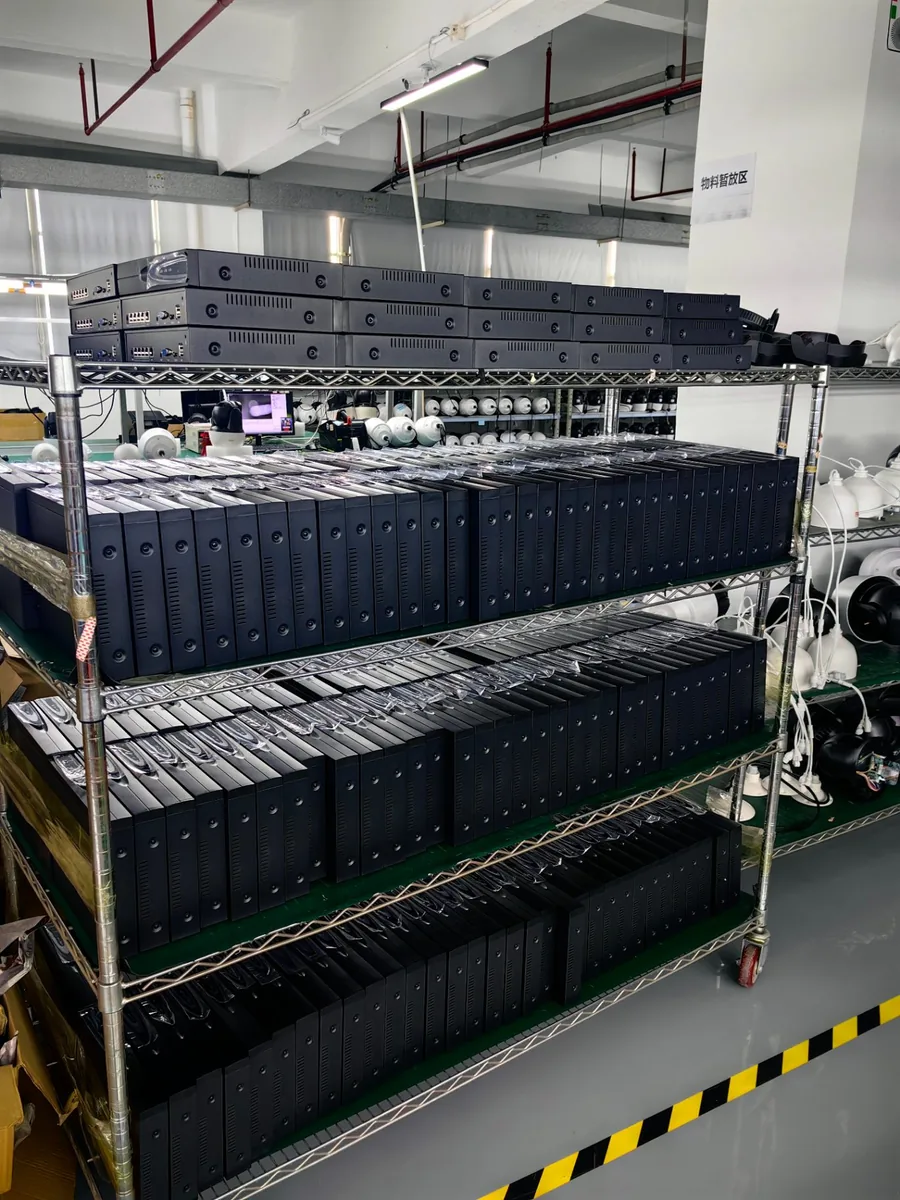 PoE NVR recorders stacked on a rack waiting for testing